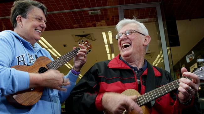 Arthur and Denise Ongley have a laugh while singing and playing.