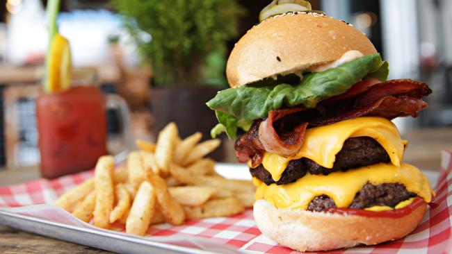 The Lumberjack burger with beer battered fries and the The Caesar, the Canadian Bloody Mary. Picture: Adam Yip