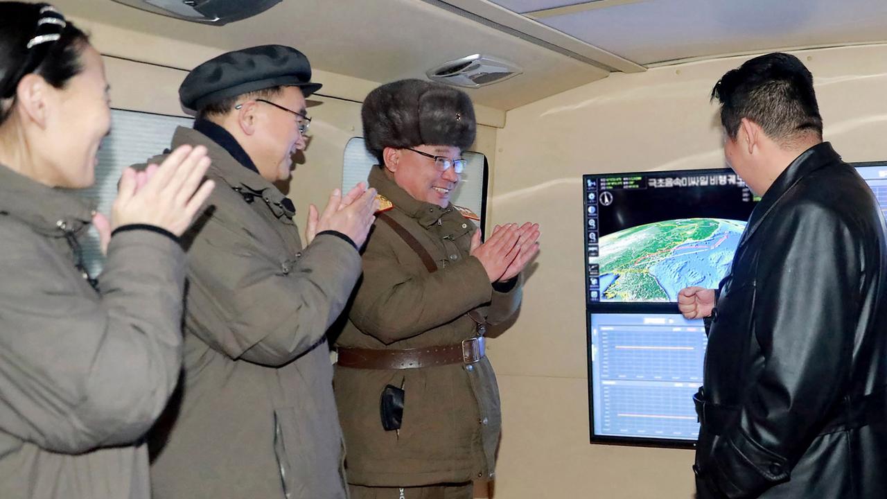 This picture taken on January 11, 2022 and released from North Korea's official Korean Central News Agency (KCNA) on January 12, 2022 shows North Korean leader Kim Jong-un (R) speaking with military officials. Picture: KCNA VIA KNS / AFP