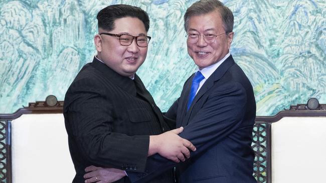 North Korea’s leader Kim Jong-un and South Korea’s President Moon Jae-in embrace at their meeting in April. Picture: Getty Images