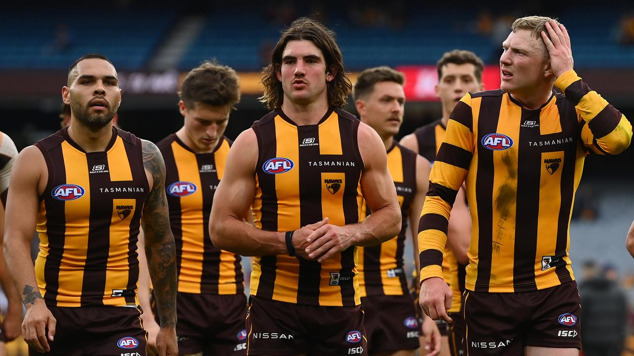 The Hawks look dejected after losing the round one AFL match. Picture: Quinn Rooney