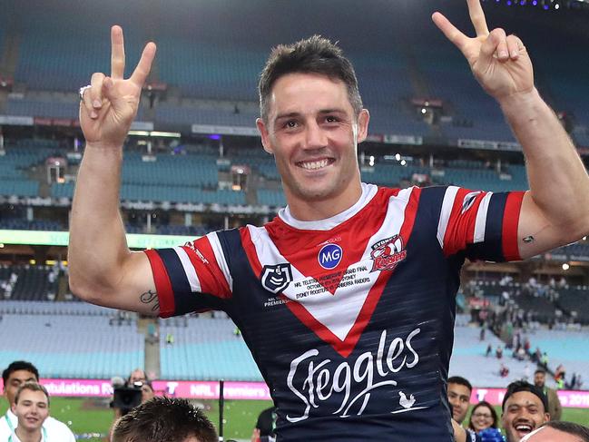 The Sydney Roosters' Cooper Cronk in his final game is chaired from the field during the 2019 NRL Grand Final between the Sydney Roosters and Canberra Raiders at ANZ Stadium on 6 October, 2019 in Sydney. Picture. Phil Hillyard