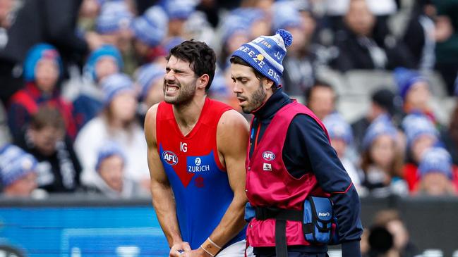 Christian Petracca leaving the field injured. (Photo by Dylan Burns/AFL Photos via Getty Images)