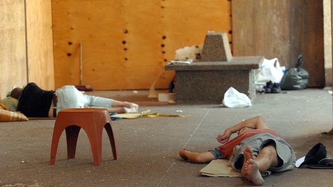 Homeless people sleep on the front porch of the vacant and derelict former Brisbane Water County Council building in Mann Street Gosford.