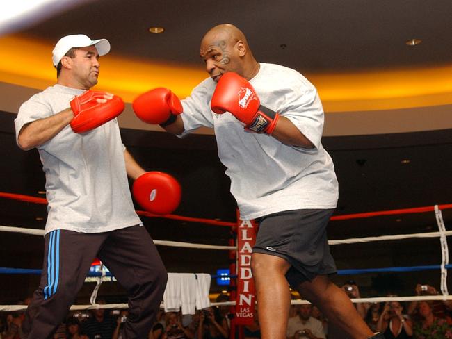 Former heavyweight boxing champion Mike Tyson with his trainer Jeff Fenech at the Aladdin Hotel in Las Vegas in 2006.