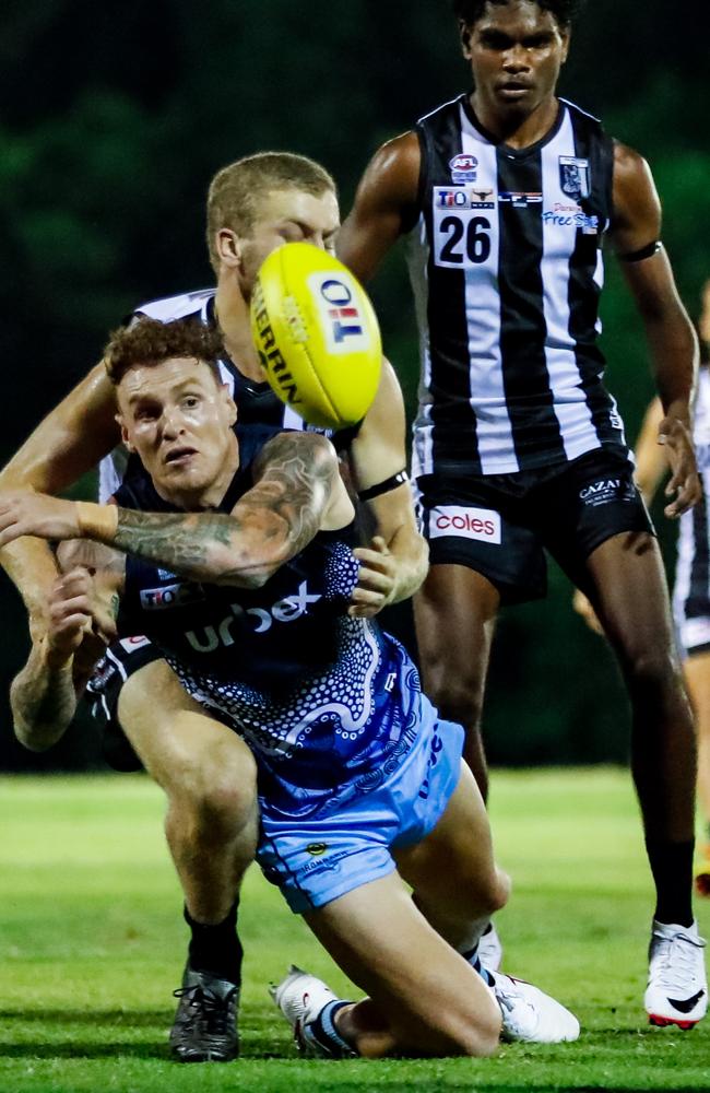 Mitch Robinson gets the ball away for Darwin Buffaloes after taking a big tackle against Palmerston in Round 4 of the 2023-24 NTFL season. Picture: Celina Whan / AFLNT Media