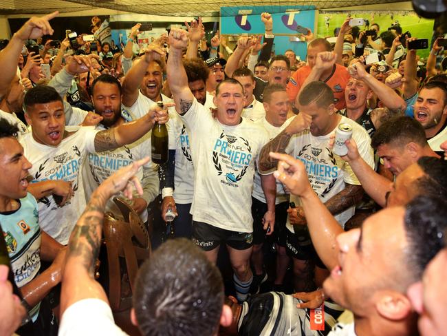 Gallen leads the celebrations in the rooms after victory before taking himself to hospital. Picture: Gregg Porteous