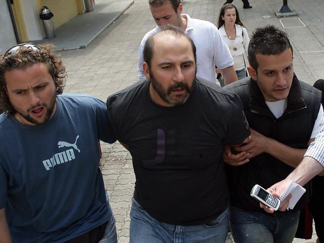 Tony Mokbel escorted by Greek police.