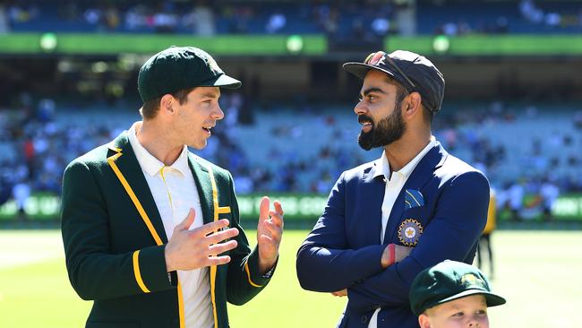 MELBOURNE, AUSTRALIA - DECEMBER 26: Tim Paine of Australia and Virat Kohli of India chat before the coin toss during day one of the Third Test match in the series between Australia and India at Melbourne Cricket Ground on December 26, 2018 in Melbourne, Australia. (Photo by Quinn Rooney/Getty Images)