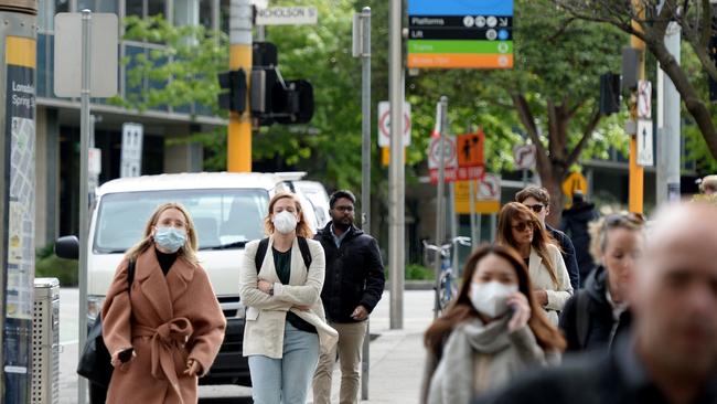 People wearing masks in central Melbourne this month. Picture: NCA NewsWire / Andrew Henshaw