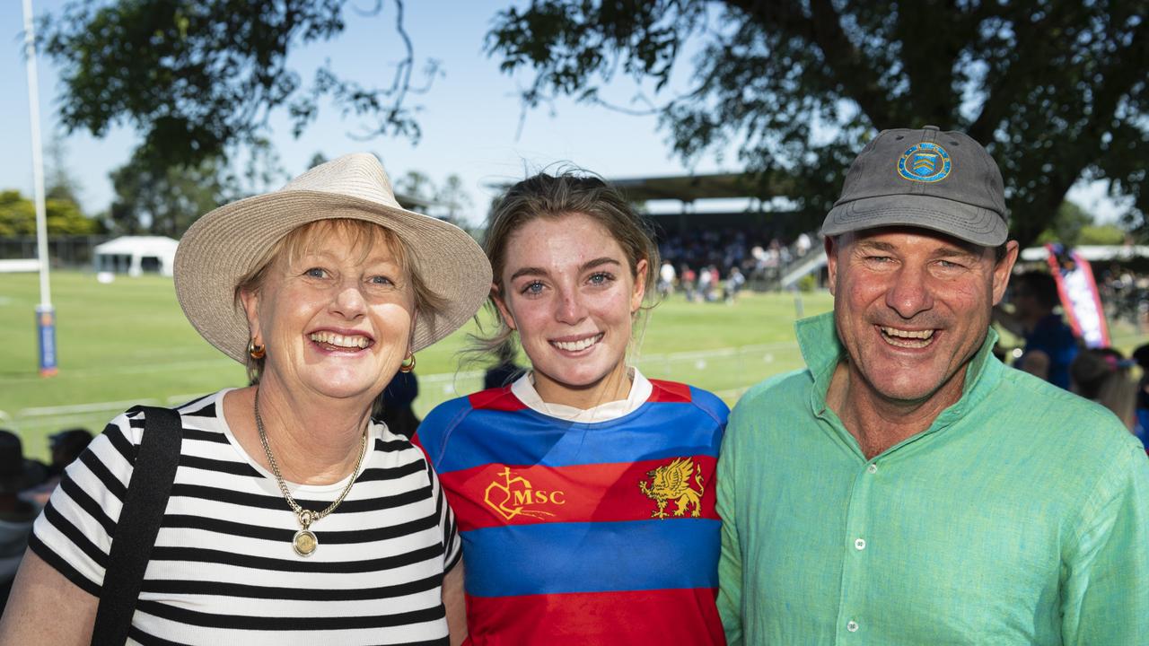 Downlands student Georgina Loughnam reunites with her primary school teacher Jo Clark and Jo's husband Philip Clark. Picture: Kevin Farmer