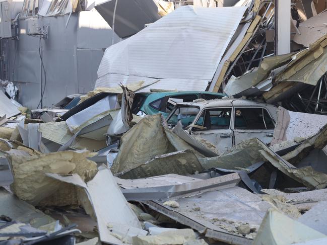 Cars under ruins in front of the shopping and entertainment centre in the Ukrainian Black Sea city of Odessa on May 10, 2022. Picture: AFP