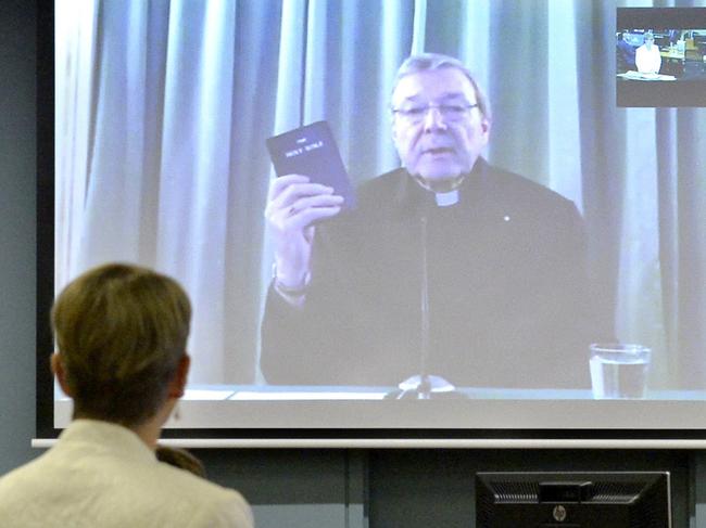 This handout photo taken and received on February 29, 2016 shows Australia's Cardinal George Pell giving evidence via video-link (C) from a hotel in Rome to the Royal Commission into Institutional Responses to Child Sexual Abuse in Sydney. Vatican finance chief Cardinal George Pell admitted on February 29 the Catholic Church 