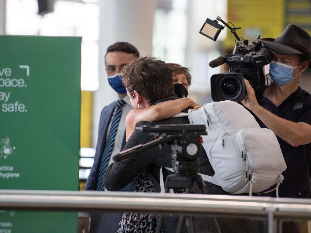 Sue Stevens hugs her son Ben Stevens at Brisbane International airport as borders re-open. Picture: Brad Fleet