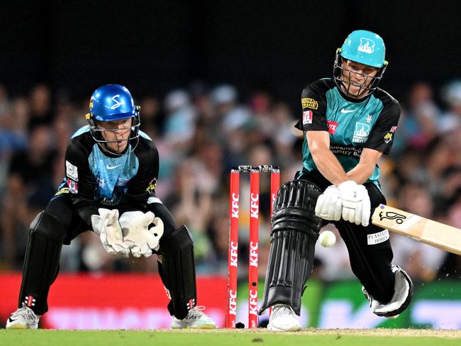 Nathan McSweeney plays a reverse sweep during his match-winning innings for Brisbane Heat against the Adelaide Strikers. Picture: Bradley Kanaris/Getty Images