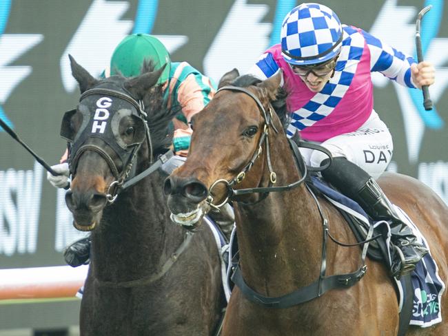 Louise Day (pink) on Man Of Peace wins the Sky Racing Active Handicap.