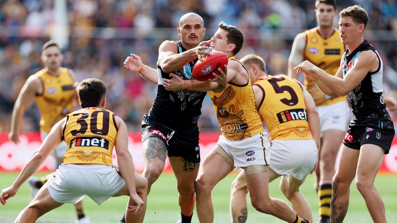 Sam Powell-Pepper breaks through a Luke Breust tackle. Picture: James Elsby/AFL Photos