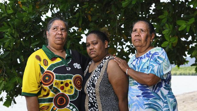 Moira Murgha, Kamaree Major and Adelaide Sands, pictured on Yarrabah Beach, are appealing for information on the whereabouts of Yarrabah teenager Markiah Major, 17, who was last seen in Cairns on August 15. Picture: Brendan Radke