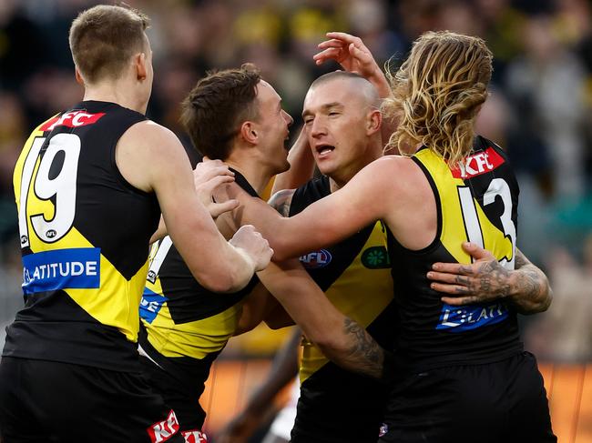 MELBOURNE, AUSTRALIA - JUNE 15: Dustin Martin of the Tigers celebrates a goal with teammates during the 2024 AFL Round 14 match between the Richmond Tigers and the Hawthorn Hawks at The Melbourne Cricket Ground on June 15, 2024 in Melbourne, Australia. (Photo by Michael Willson/AFL Photos via Getty Images)