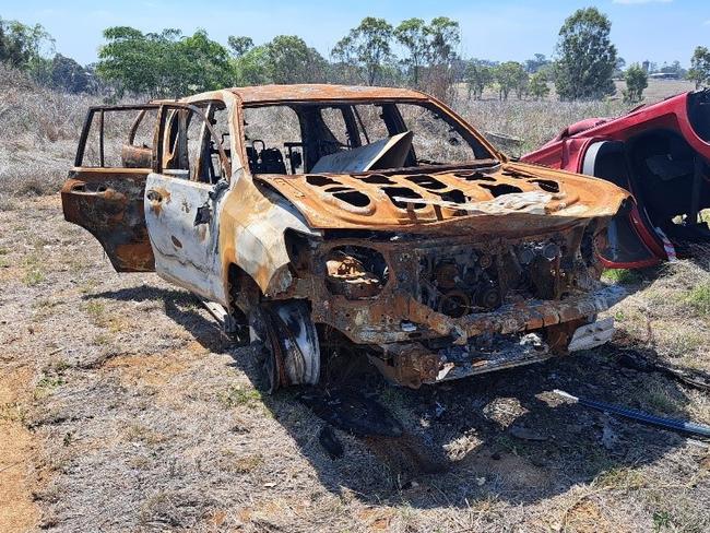 Unregistered, burnt out, five door Toyota Prado wagon.