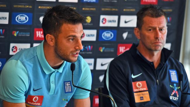 Greek football player Andreas Samaris (L) and coach Michael Skibbe (R).