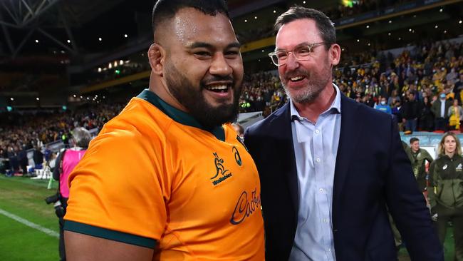 BRISBANE, AUSTRALIA - JULY 17: Taniela Tupou and assistant coach Dan McKellar of the Wallabies celebrate winning the International Test Match between the Australian Wallabies and France at Suncorp Stadium on July 17, 2021 in Brisbane, Australia. (Photo by Jono Searle/Getty Images)