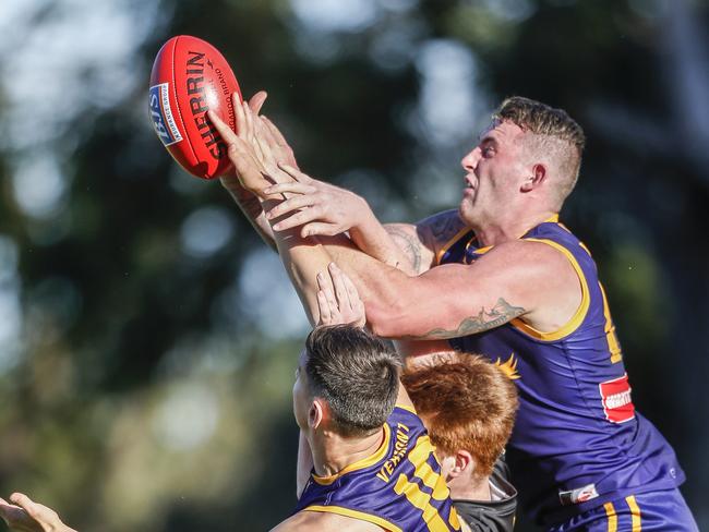 Vermont ruckman Liam Buxton flies for a mark. Picture: Valeriu Campan