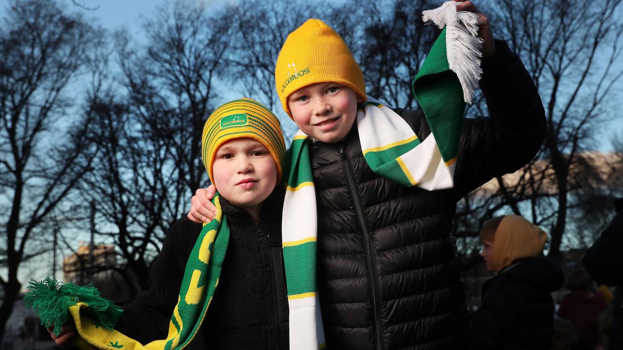 Archie Bolton 7 with brother Ewan Bolton 10. Livescreen on parliament lawns Hobart for Matilda's World Cup quarter final against France. Picture: Nikki Davis-Jones