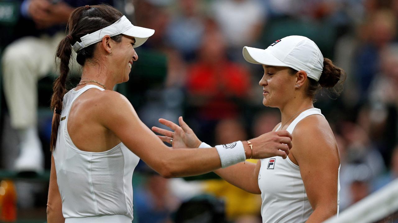Ashleigh Barty embraces Ajla Tomljanovic after their Wimbledon match. Picture: Adrian Dennis / AFP