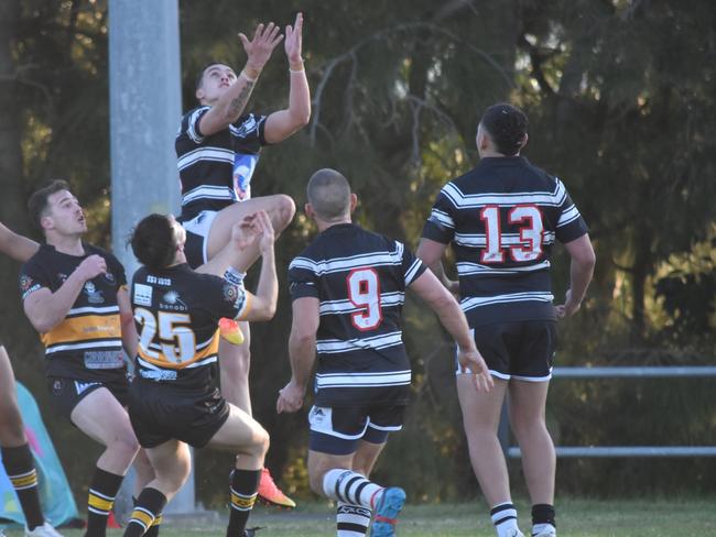 Beau-Josh Lyons leaps for the kick-off. Picture: Sean Teuma/NewsLocal