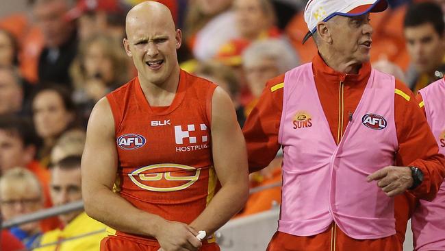 Gary Ablett walks off the ground after hurting his shoulder. Picture: Getty Images