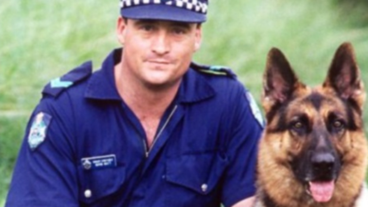 Senior Constable Norman James Watt of the Rockhampton dog squad with his dog Zeus.