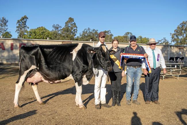 Supreme champion dairy cow Hillview Park Ariel Juliana 2, lead by Andrew Cullen, for owner Waylon Barron, Cambooya, with Miss Show Girl entrant Biancca Webster, sponsor Giles Gay, Elm Grove Ag Services, and judge Mark. Picture: ALI KUCHEL