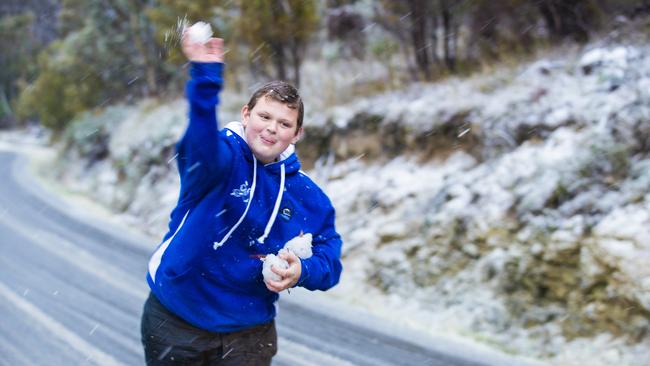 Riley Direen playing in the snow in Berriedale where roads became impassable on Tuesday afternoon. Picture: Richard Jupe