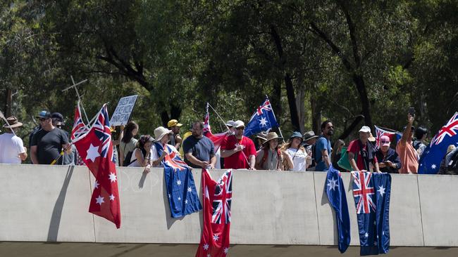 Protesters have swamped lawns at the front of Parliament House after marching over nearby bridges. Picture: NCA NewsWire / Martin Ollman