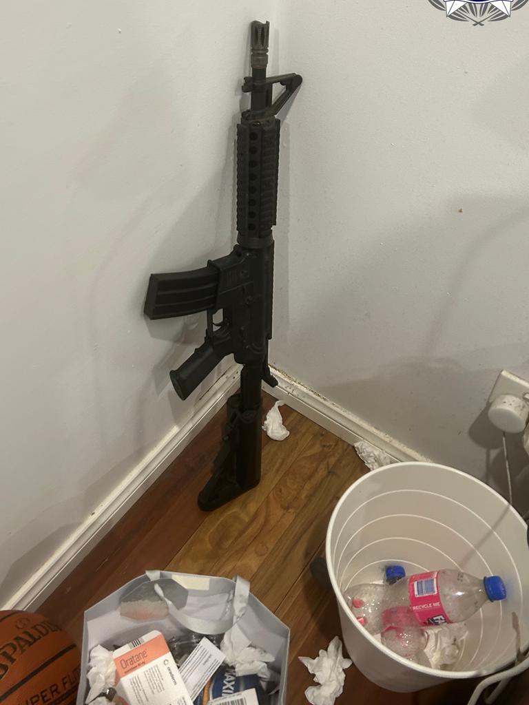 Police seized an assault rifle in the raids. Picture: AFP