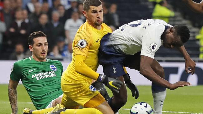 Mat Ryan does his best to keep Spurs at bay.