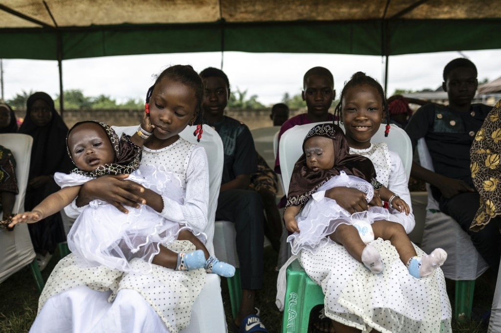 Hundreds of people gathered in the self-proclaimed 'twins capital of the world' to celebrate its unusually high rate of multiple births