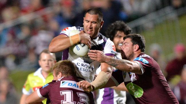 SYDNEY, AUSTRALIA — AUGUST 20: Nelson Asofa-Solomona of the Storm takes on the defence during the round 24 NRL match between the Manly Sea Eagles and the Melbourne Storm at Brookvale Oval on August 20, 2016 in Sydney, Australia. (Photo by Bradley Kanaris/Getty Images)