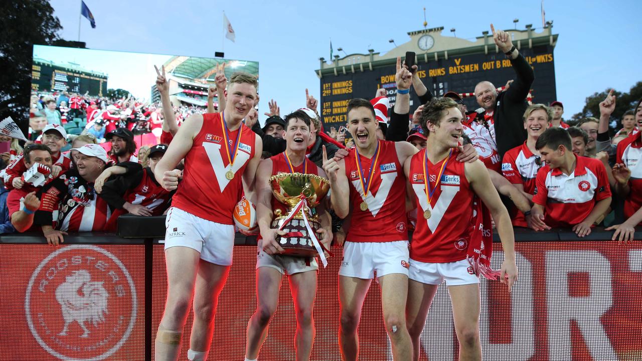 SANFL GRAND FINAL - Norwood versus North Adelaide. North Adelaide players celebrate. Samuel McInerney with cup and team mates. 23 September 2018. (AAP Image/Dean Martin)