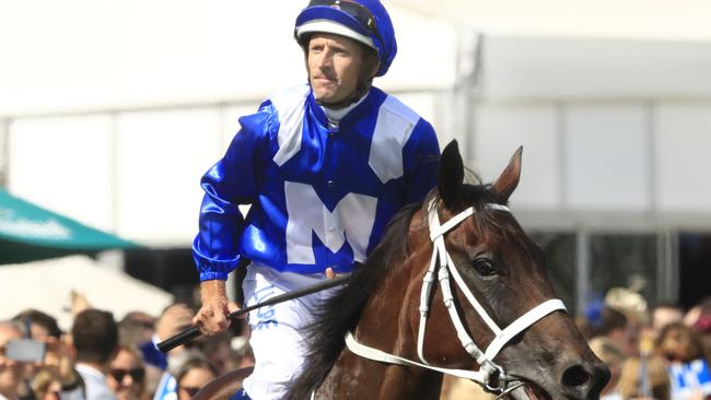 Hugh Bowman on Winx returns to scale after winning the Apollo Stakes in February.