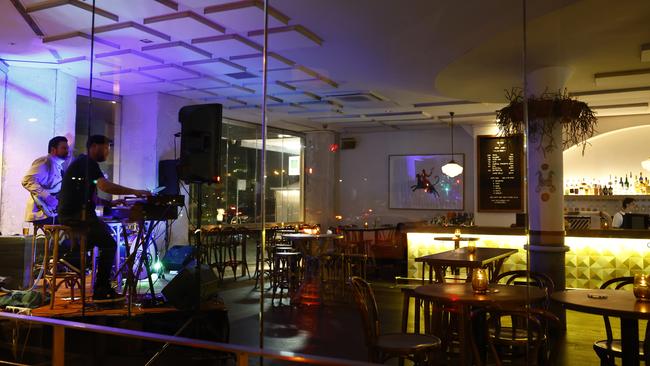 Musicians perform at a near-empty Hotel Ravesis. Picture: Jonathan Ng