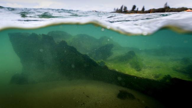 The ghostlike remains of the SS Dicky lie just below the surface at Caloundra. Picture: Lachie Millard