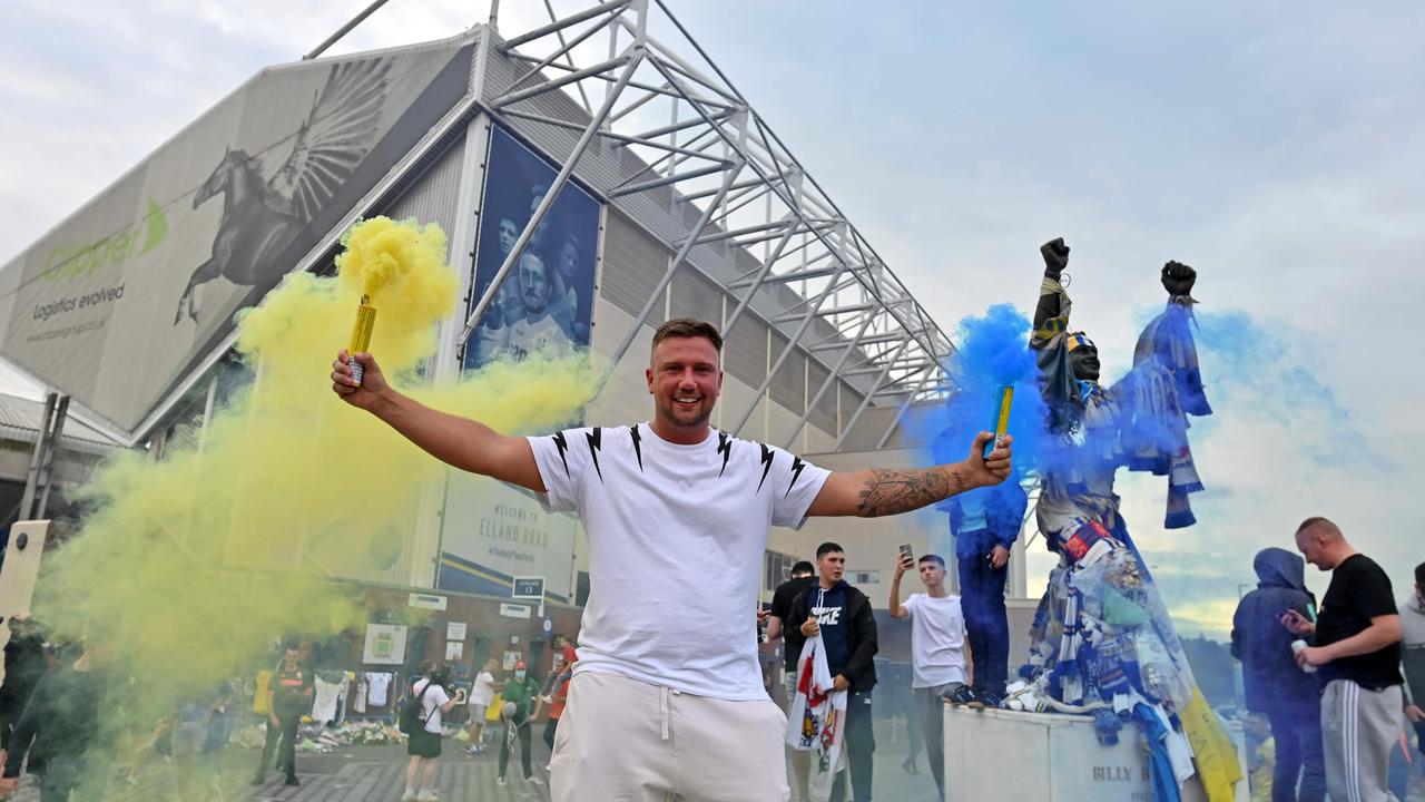 Leeds United supporters gather outside their Elland Road ground to celebrate the club's return to the Premier league.