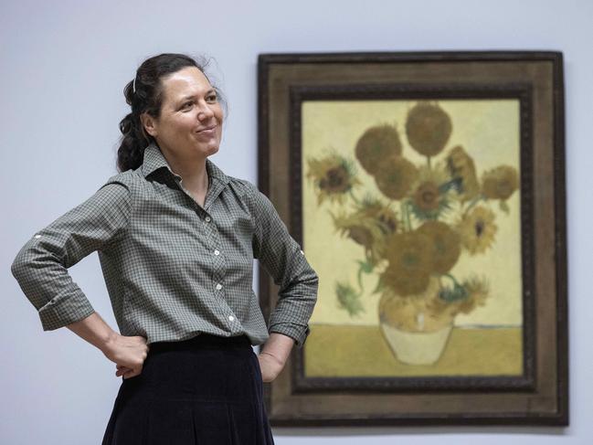 CANBERRA, AUSTRALIA- NewsWire Photos FEBRUARY 22, 2021: The installation team at the NGA hung Van Gogh's famous painting, Sunflowers. Sunflowers normally hangs in the National Gallery, London. It is one of the most loved paintings in the world. Coordinating curator Sally Foster with the Sunflowers.Picture: NCA NewsWire/Gary Ramage