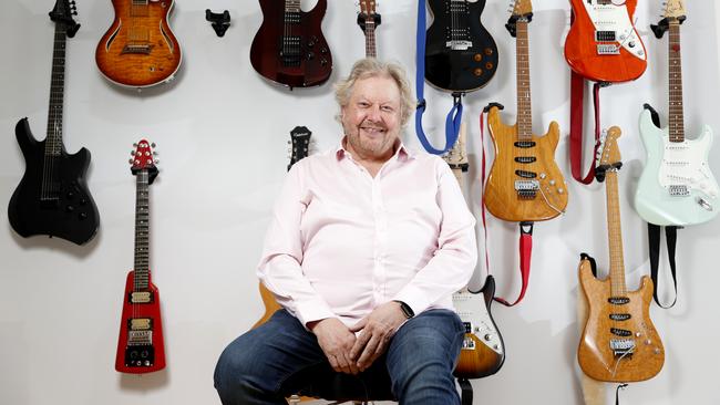 Richard White and the many guitars in his office. Picture: Jonathan Ng