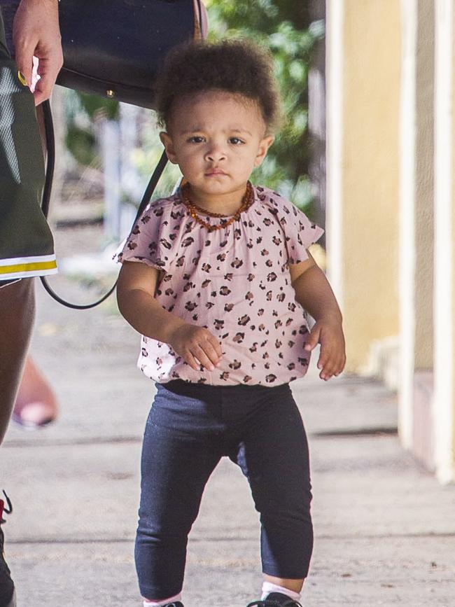 Serena Williams and her husband Alexis Ohanian enjoy an afternoon walk with their 1-year-old daughter Alexia Olympia. Serena's daughter looked seriously cute, toddling her way down the footpath, wearing Nike sneakers like her Mummy. Picture: MediaMode