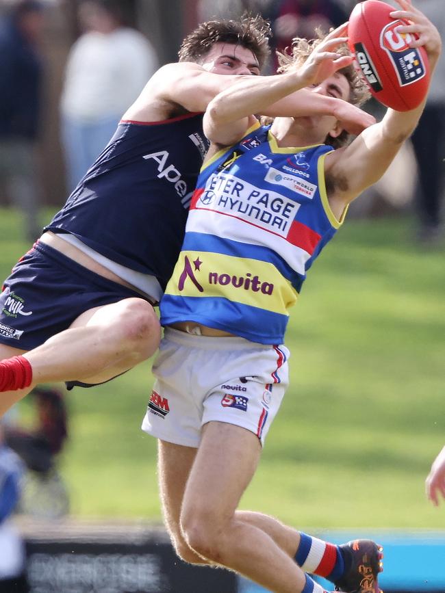 Norwood’s Nik Rokahr attempts to spoil a mark from Central District’s Chris Olsson at Elizabeth Oval on Saturday. Picture: SANFL Image / David Mariuz