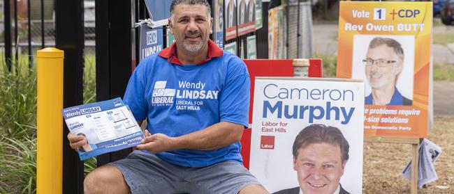 Sam Wassim Daniel manning the booth for Wendy Lindsay at the pre-polling at Violet St, Revesby. Picture: Matthew Vasilescu