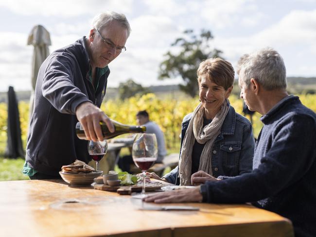 Craigie Knowe owner Glenn Travers pours some wine to guests at his picturesque Cranbrook vineyard. Picture: Prime Perspectives